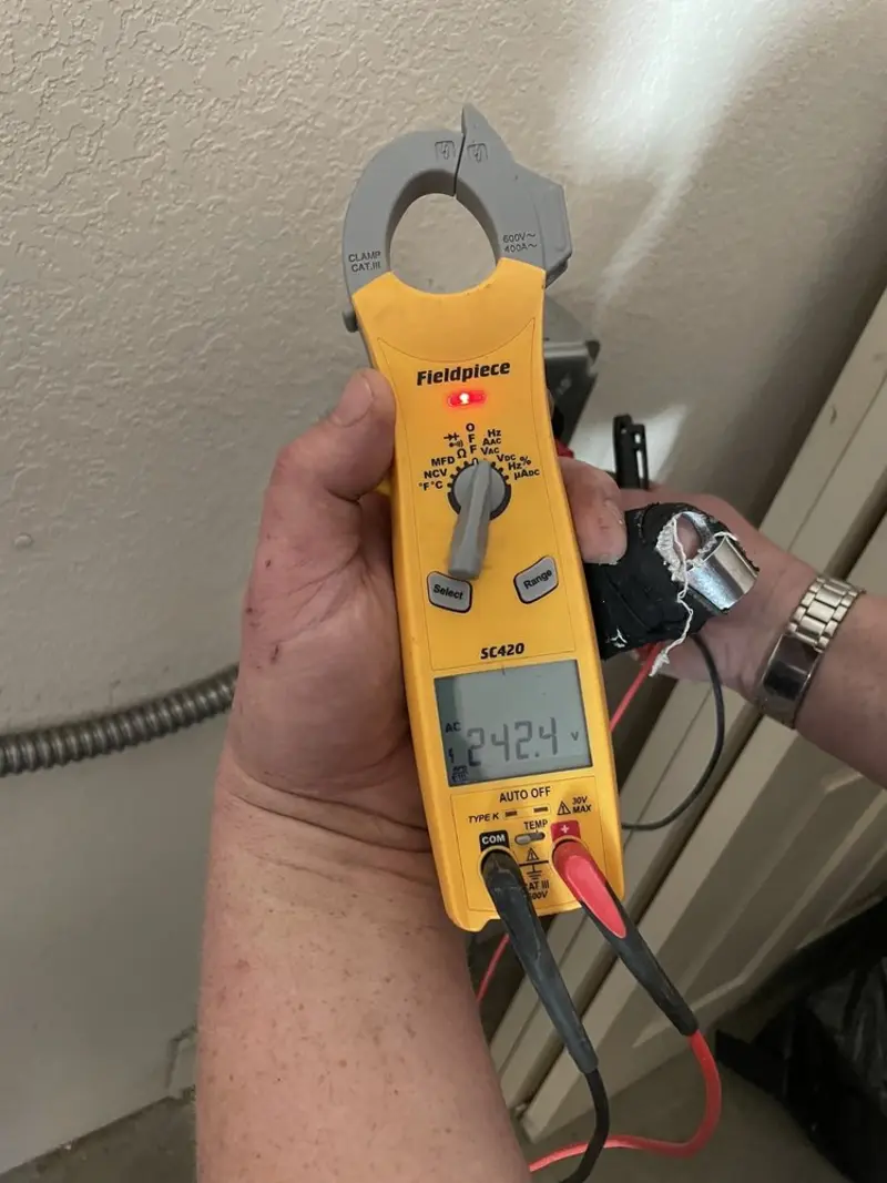 Voltage testing with clamp meter during Electrical Installation Services in Colorado Springs